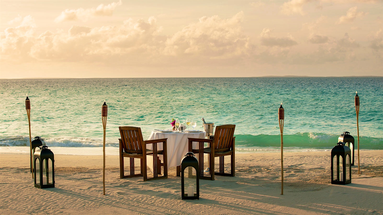 Tables set for Julian’s guests at the beach